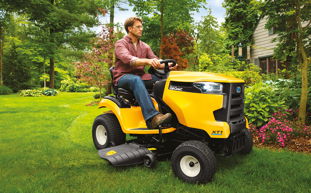 zero-turn mower plowing snow with blade